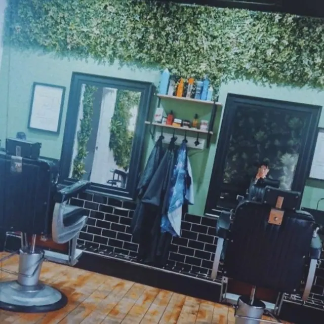 Inside John's Barbers: the chair and tiled wall