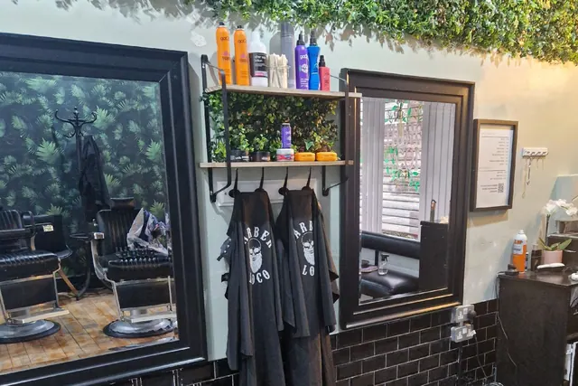 The shelves and mirror at John's Barbers